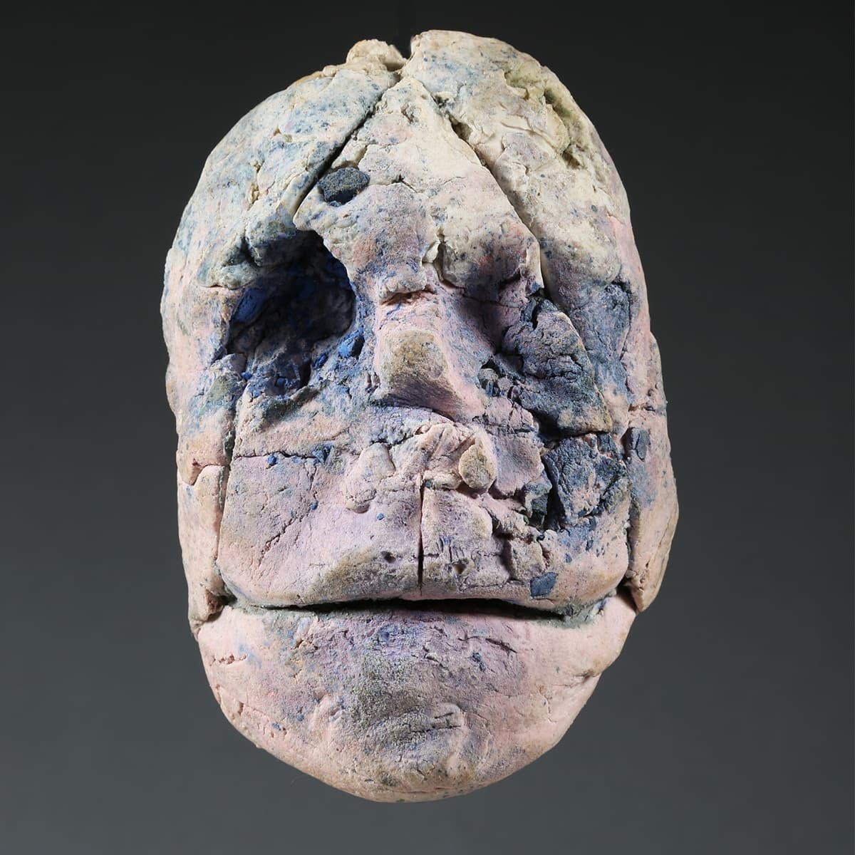 Stephen De Staebler (American, 1933–2011), Lavender Face with Missing Eye, 1976. Pigmented stoneware, 7 x 4 x 2 1/2 in. Estate of Stephen De Staebler.