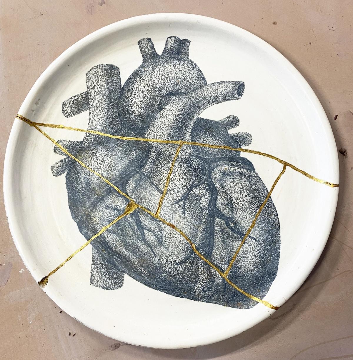 Bryan Valenzuela, Kintsugi Heart (artist proof test plate), 2021. Ceramic and gold, 10 x 10 in.