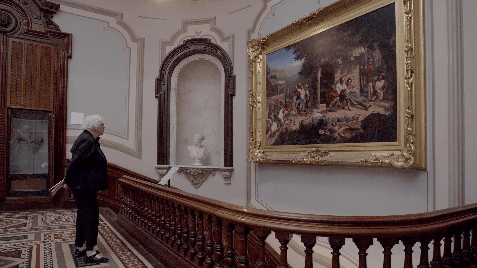 Fig. 8: Gladys Nilsson in front of Sunday Morning in the Mines (1872) by Charles Christian Nahl, Crocker Art Museum, October 2024. Photo: Brian Suhr.