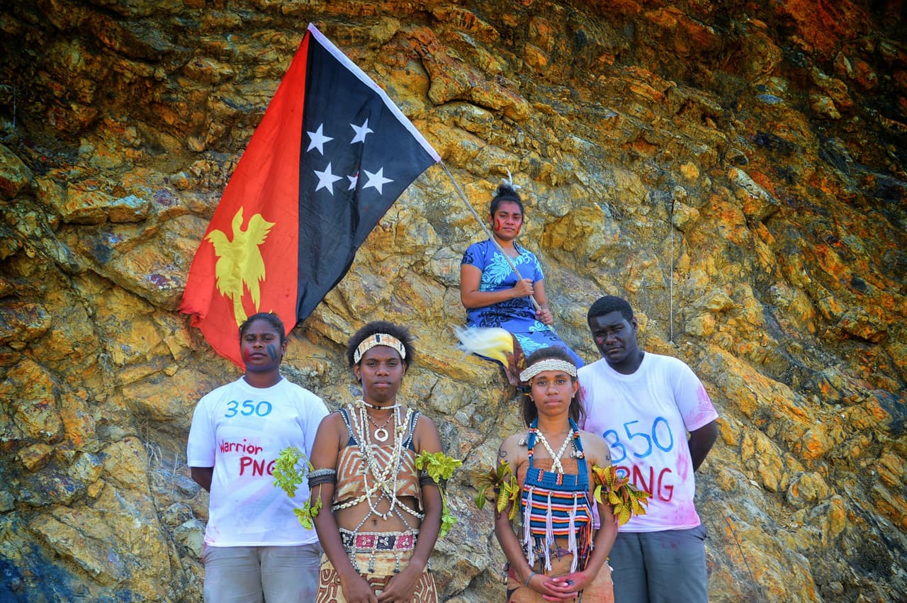 Papua New Guinean members of the climate justice group 350.org raise awareness about global warming by dressing in customary adornment and holding the Papua New Guinea flag. Once stereotyped as fierce warriors, these Papua New Guineans are now proud to be 'climate warriors' fighting for the environment and a sustainable future.