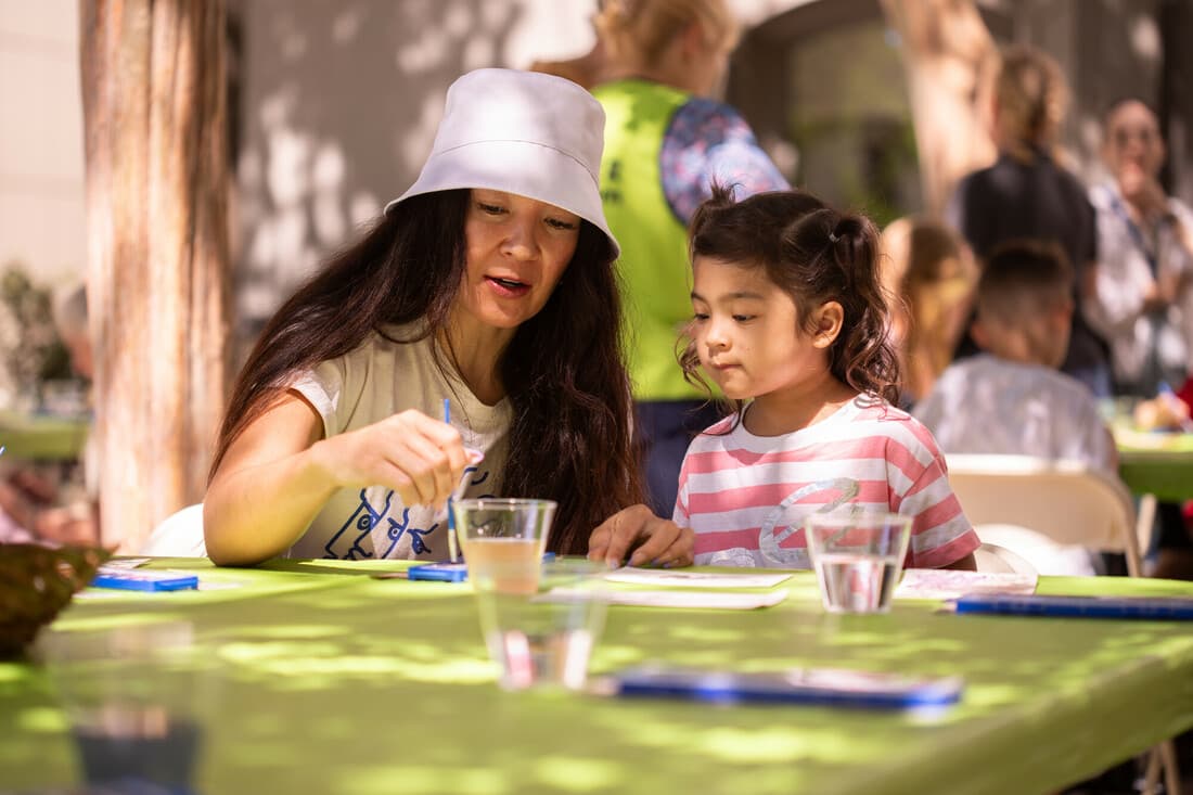 Parent and child enjoying outdoor artmaking at WeCreate!