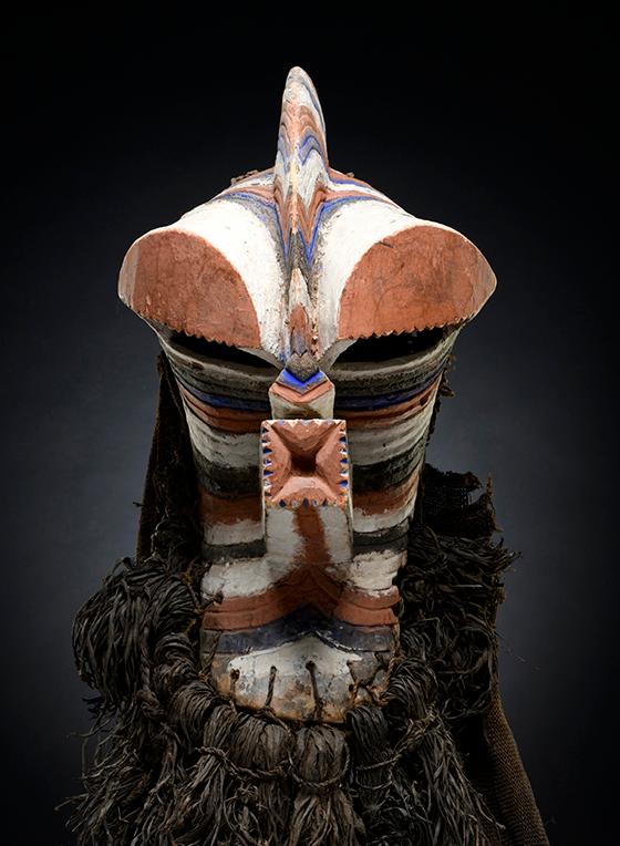 Songye people (Central Africa), Male Kalebwe [Central Songye] Kifwebe Mask [Kilume], mid-20th century. Wood, raffia, burlap, natural pigments, Reckitt's blue, 19 in. (wood). Woods Davy and Kathleen Dantini Collection.