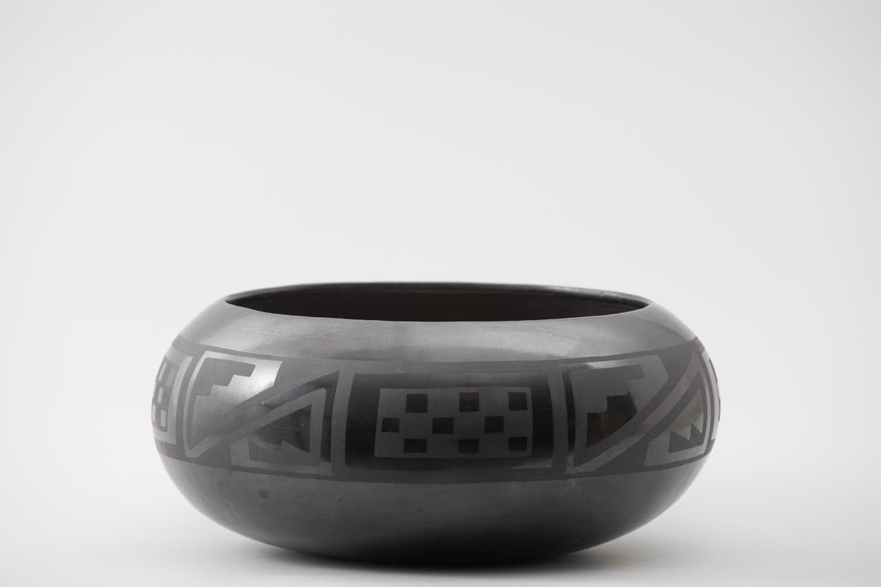 Maria Martinez (San Ildefonso, 1887–1980) and Julian Martinez (San Ildefonso, circa 1885–1943), Bowl with Checkerboard and Kiva Step Design, 1920–1929. Earthenware, 5 5/8 x 12 1/8 in. Crocker Art Museum, gift of Loren G. Lipson, M.D., 2015.71.58.