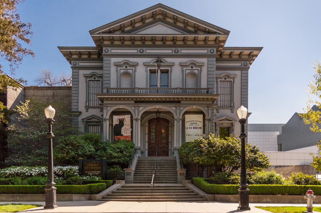 In 1868, Judge Edwin B. Crocker purchased the property and existing buildings on the corner of 3rd and O Streets. He then commissioned local architect Seth Babson (1830-1908) to renovate the home into a grander, Italianate mansion. In addition, Crocker asked Babson to design an elaborate gallery building adjacent to the mansion to display the family's growing art collection.
Babson envisioned the home and gallery as an integrated complex, unique in design and built from the finest materials. The gallery building included a bowling alley, skating rink, and billiards room on the ground floor; a natural history museum and a library on the first floor; and gallery space on the second floor. Completed in 1872, the Crocker family mansion and art gallery are considered the masterpieces of Babson's career. The family mansion went through several uses and reconstructions until a 1989 renovation restored the historic façade and created a modern gallery interior. The original buildings, now connected, as well as the since-demolished Herold Wing addition of 1969, were renamed the Crocker Art Museum in 1978. The gallery building is a California Historical Landmark and listed in the National Register of Historic Places.